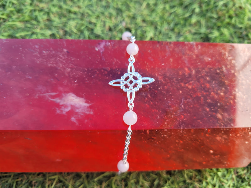 pulsera plata nudo de brujas con bolas cuarzo rosa