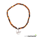 Pulsera ojo de tigre bola 2mm facetada