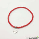 Pulsera cristal rojo con Trébol acero